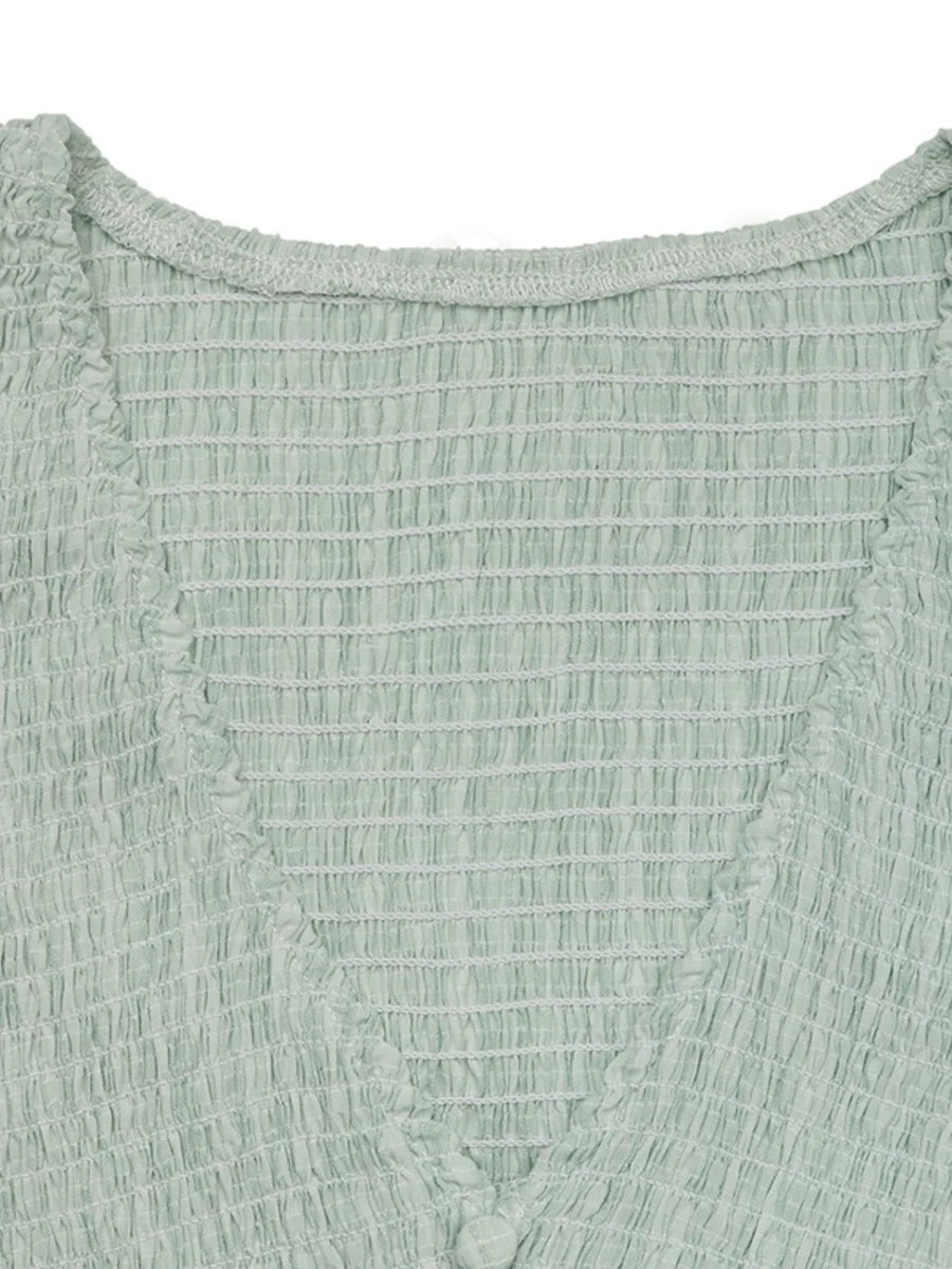 Close-up of a textured green fabric garment