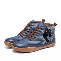 Blue high-top sneakers with brown laces and a black cat design on a white background