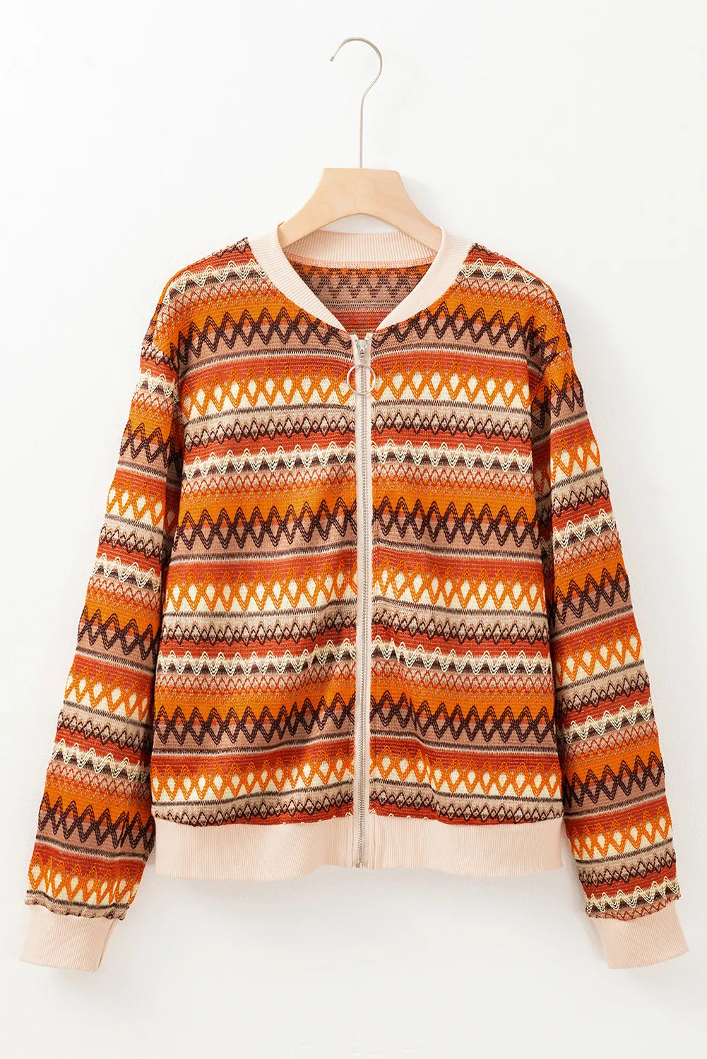 Patterned jacket on a hanger against a white background