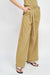 ASYMMETRICAL LONG BELT TROUSERS