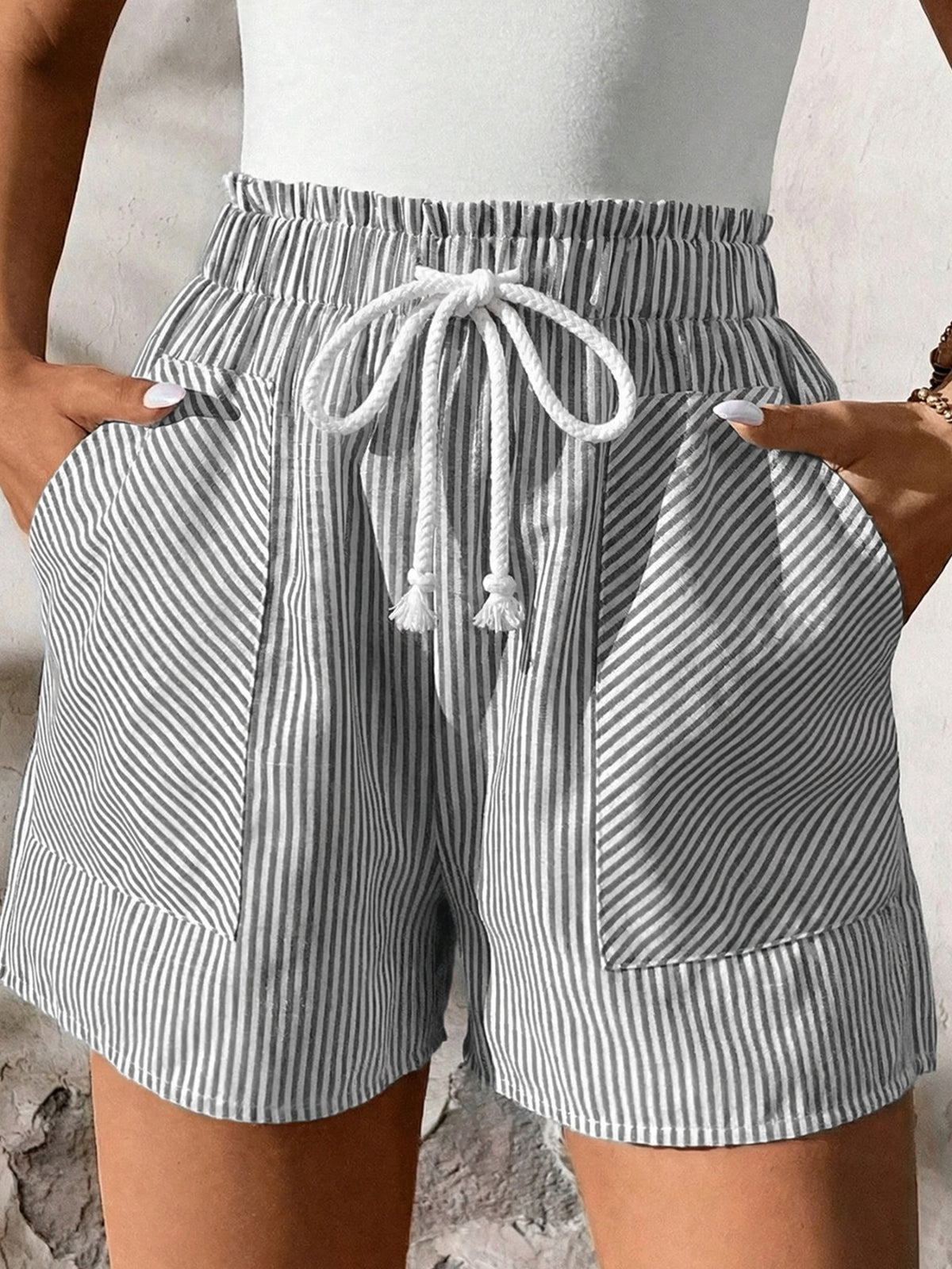 Striped shorts with drawstring waist on a neutral background