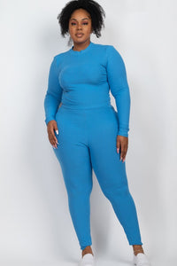 Woman wearing a blue outfit against a white background