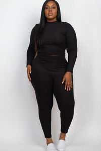 Person wearing a black outfit on a white background