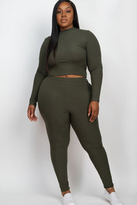 Person wearing an olive green long-sleeve top and leggings set on a white background