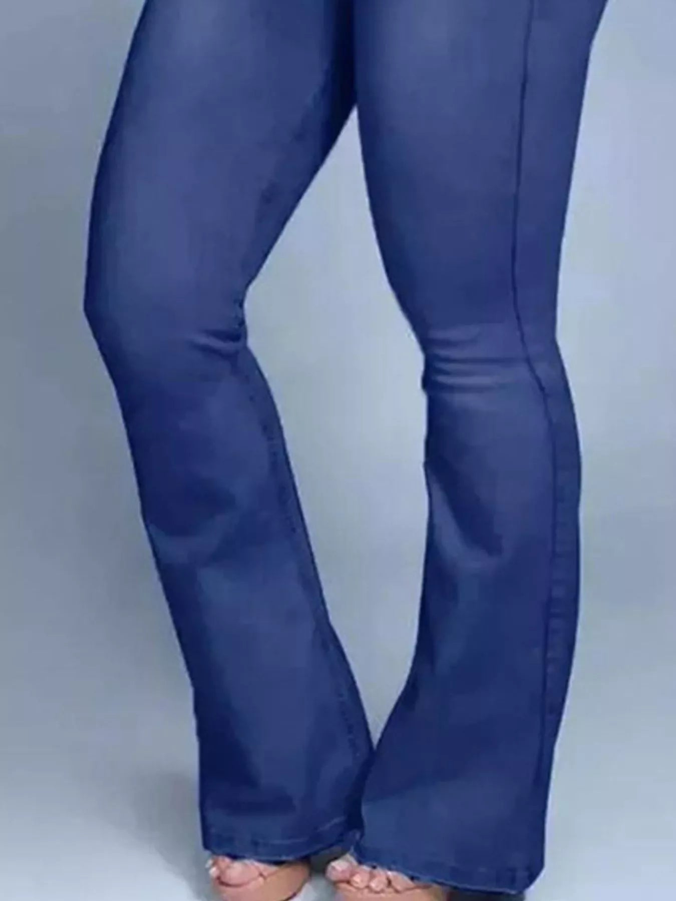 Blue jeans on a plain background
