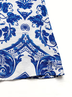 Blue and white patterned fabric on a white background
