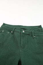 Close-up of green pants on a white background