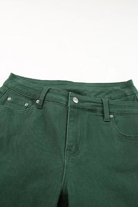 Close-up of green pants on a white background