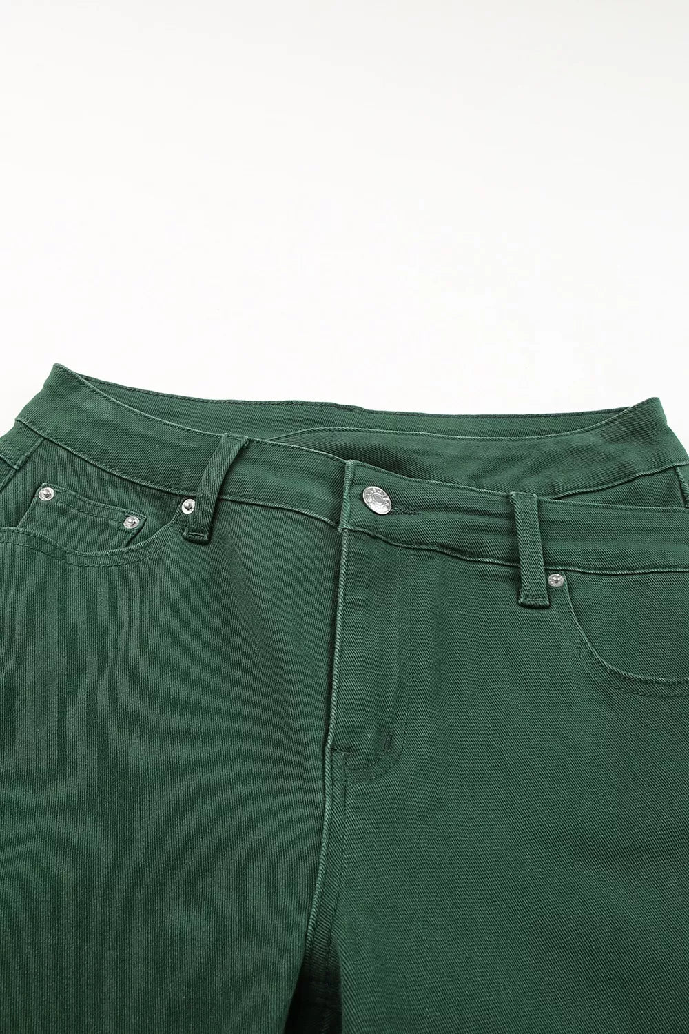 Close-up of green pants on a white background