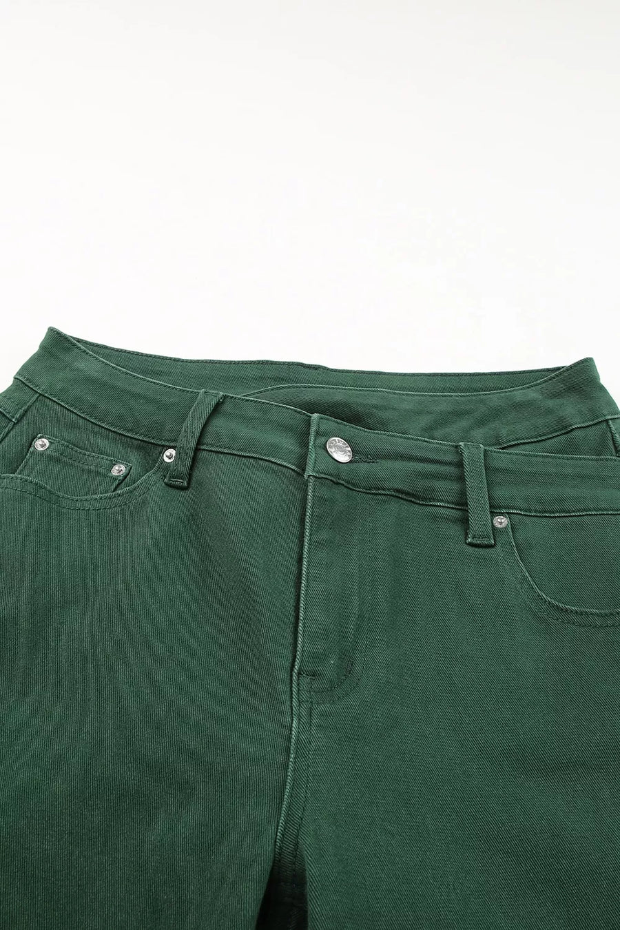 Close-up of green pants on a white background