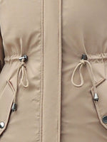Close up view of pull strings on biege Women's Detachable Longline Hooded Parka with Faux Fur Trim and Drawstring Waist