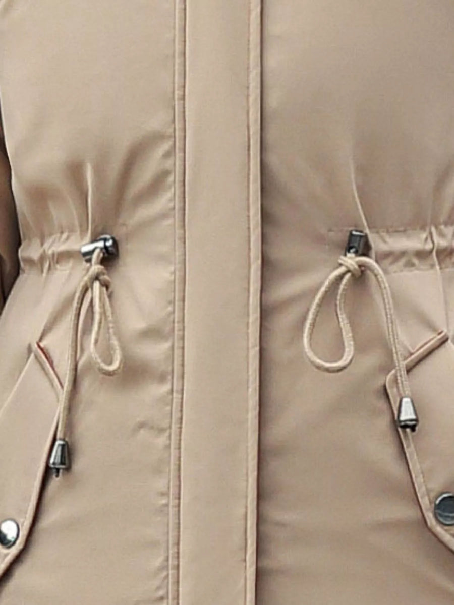 Close up view of pull strings on biege Women's Detachable Longline Hooded Parka with Faux Fur Trim and Drawstring Waist