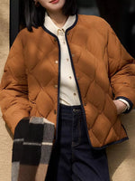 Lady showing pockets on brown Diamond-Quilted Lightweight Cropped Reversible Down Jacket