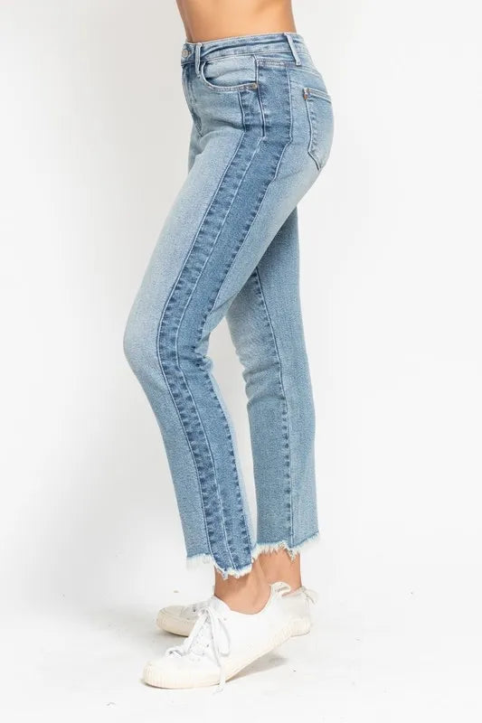 Light blue jeans worn by a person on a white background