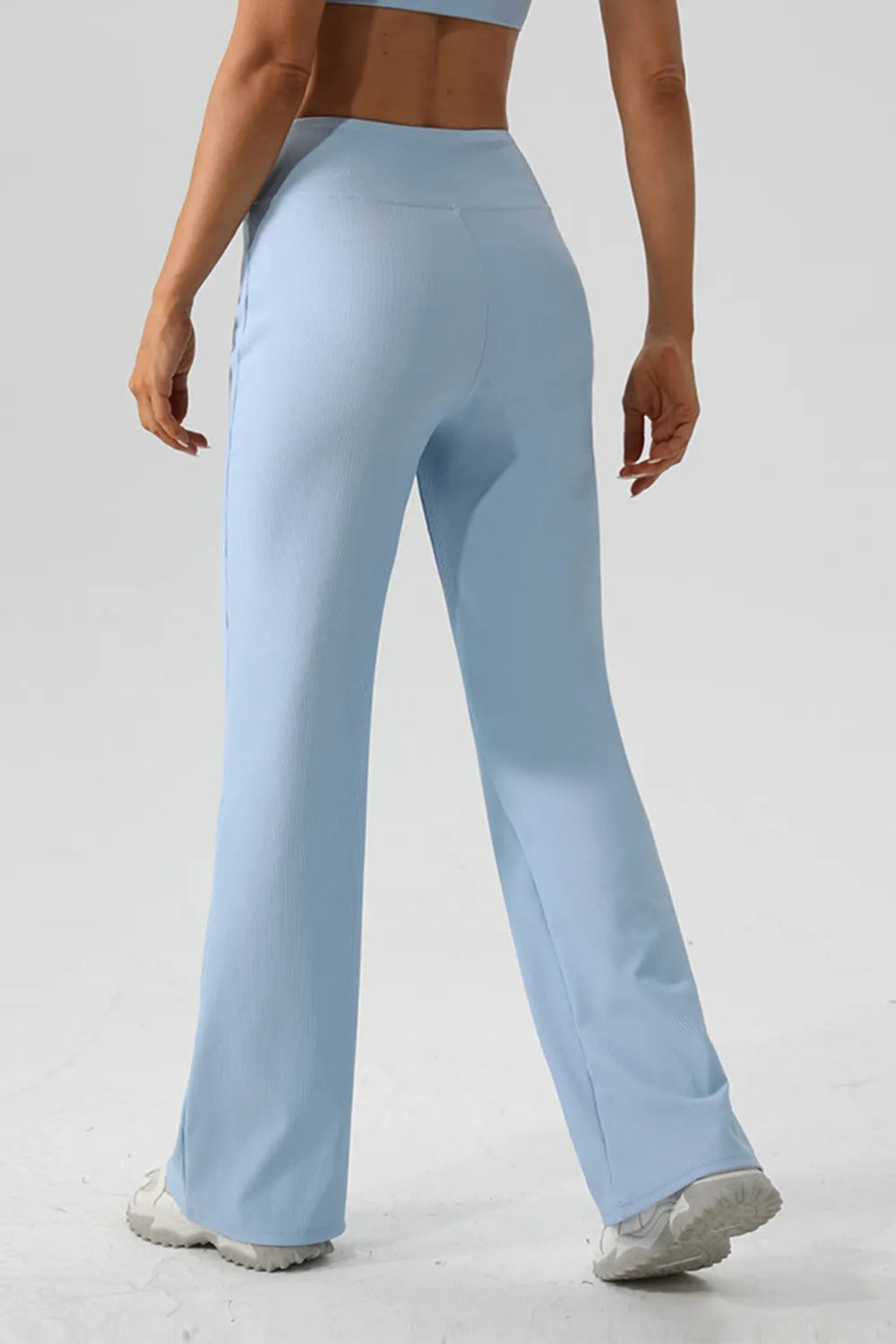 Light blue pants worn by a person on a plain background