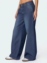 Blue pinstripe pants worn by a person on a white background