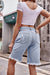 Model showing the back of Denim ripped bermuda shorts