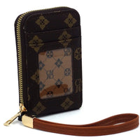Small wallet with patterned design and brown strap on a white background