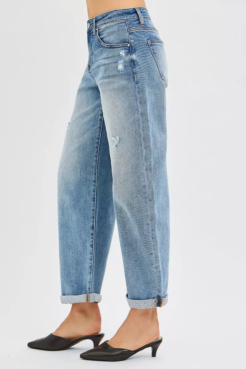 Light blue jeans with a distressed look on a white background