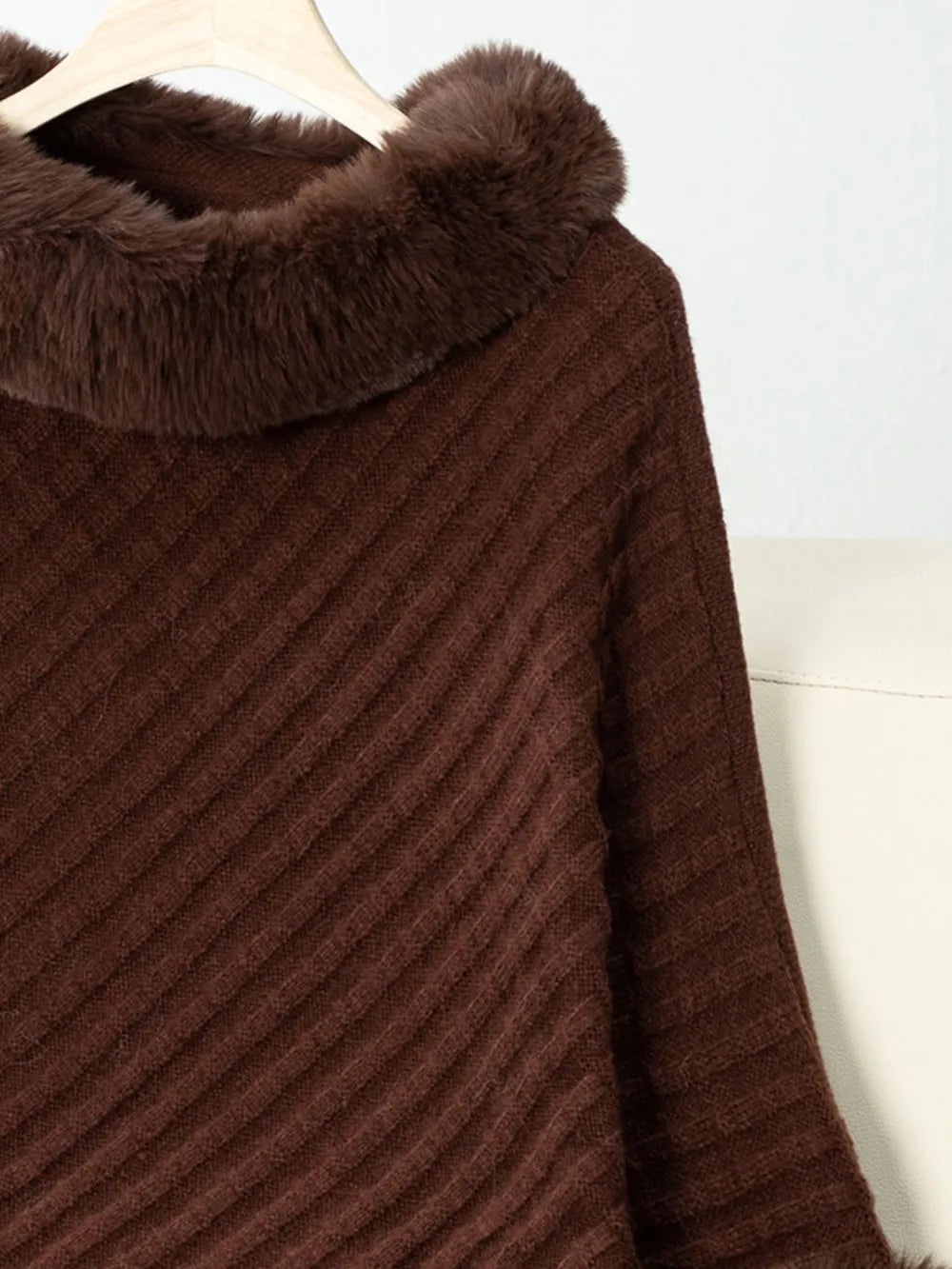 Brown textured fabric with fur trim on a white background