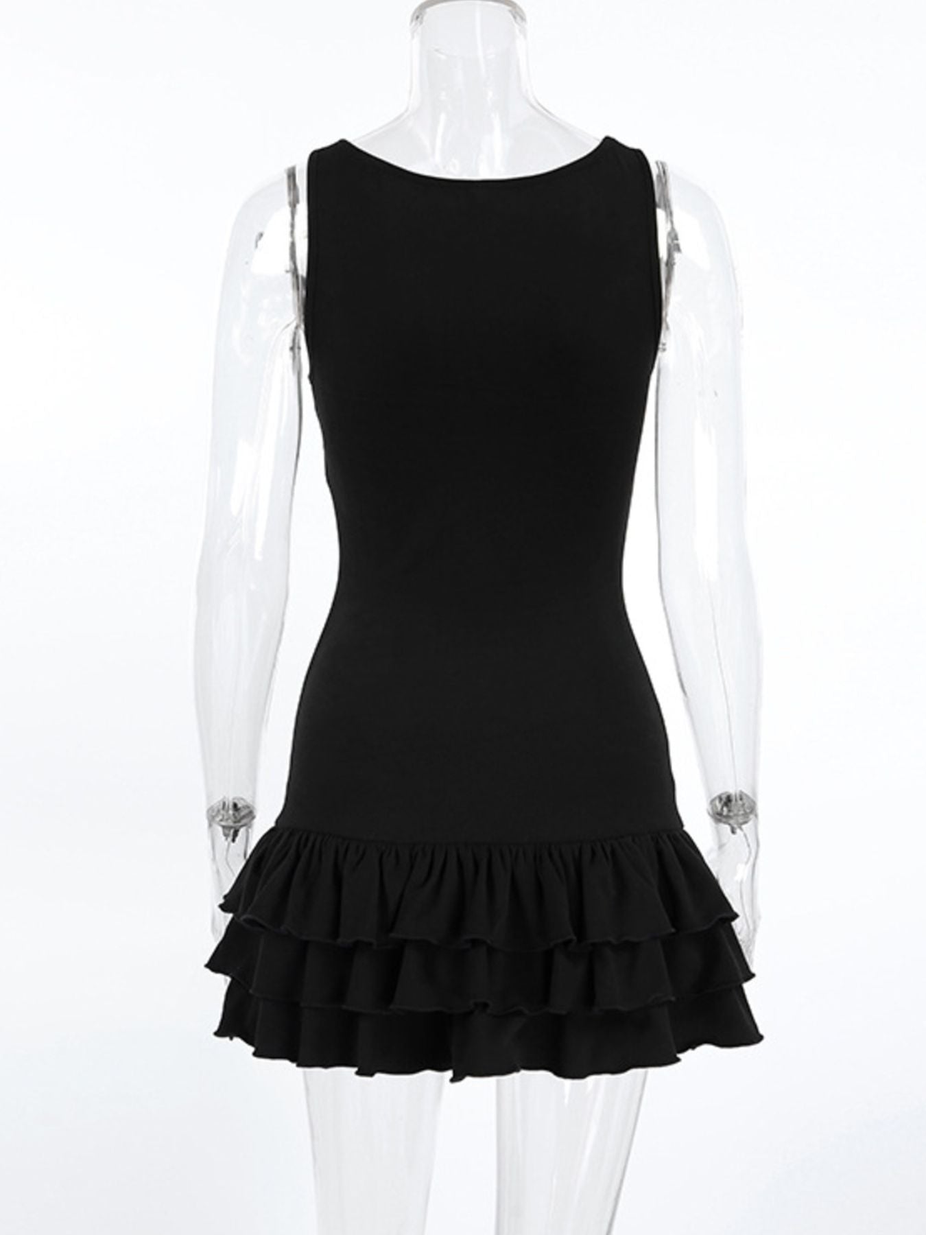 Black dress with ruffled hem on a mannequin against a white background