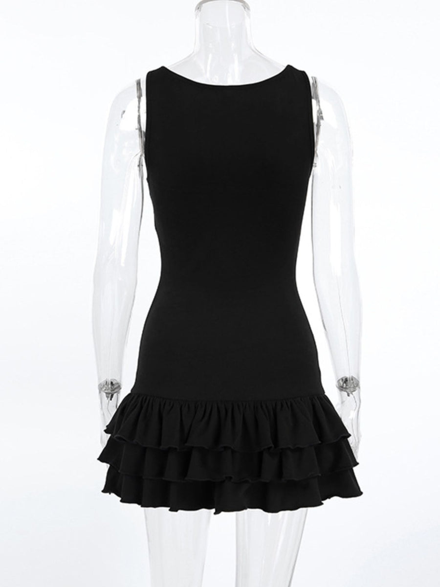 Black dress with ruffled hem on a mannequin against a white background