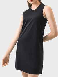 Black sleeveless dress worn by a person on a light gray background