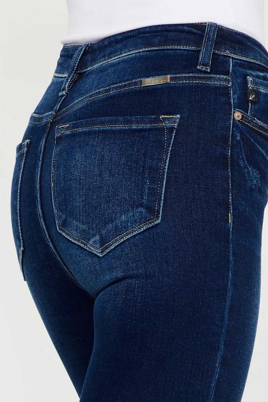 Close-up of blue jeans on a white background