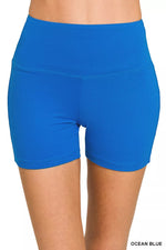 Blue athletic shorts on a white background