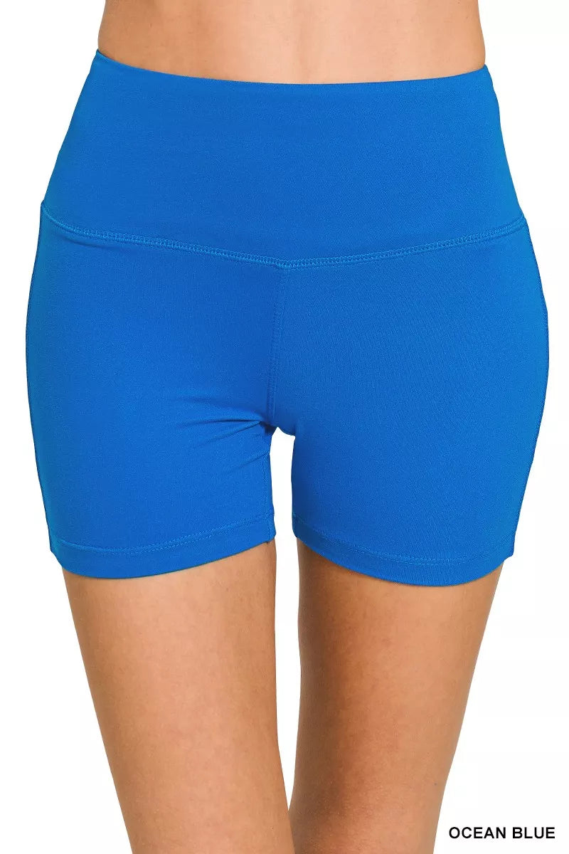 Blue athletic shorts on a white background