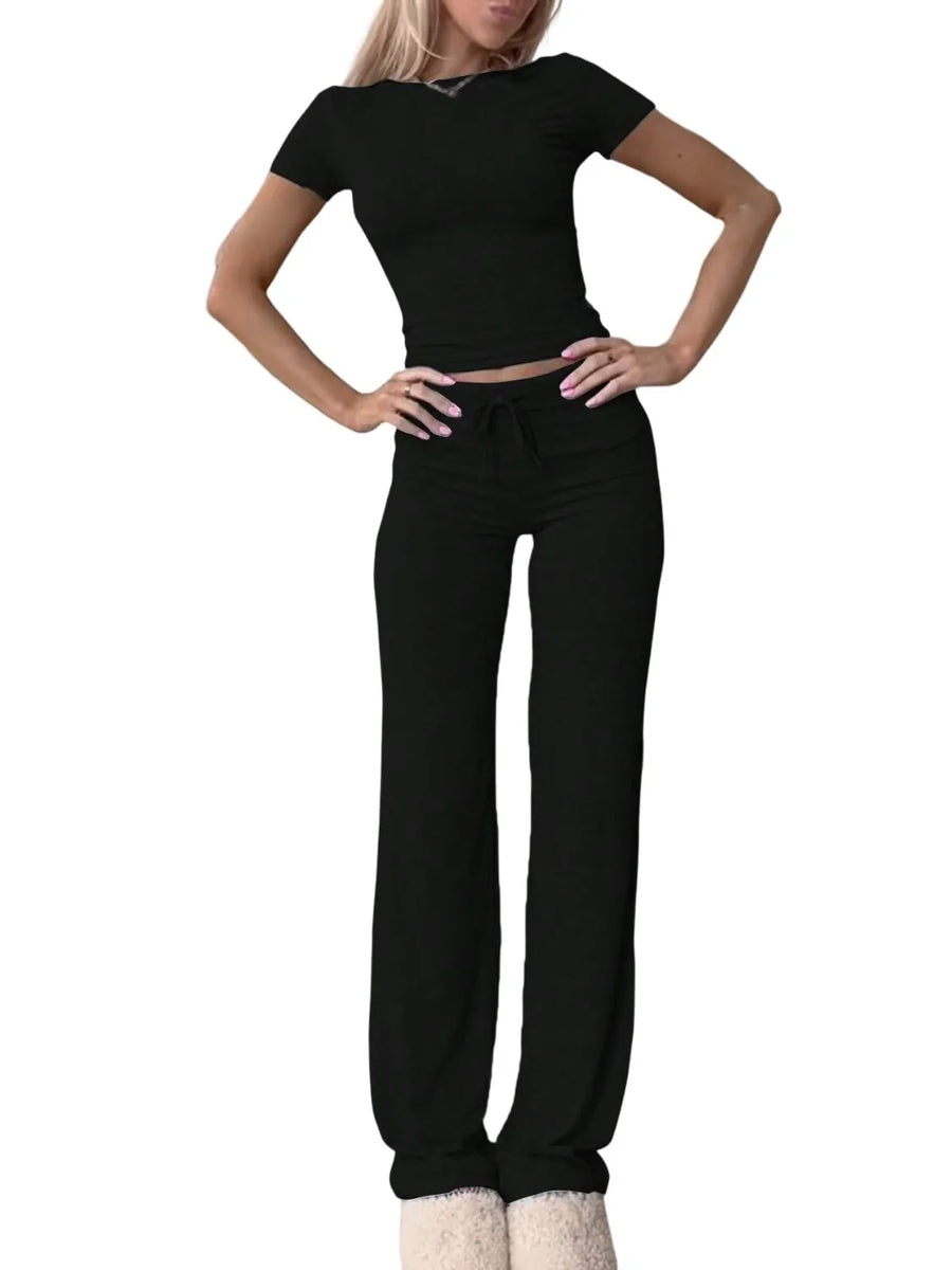 Woman wearing a black outfit on a white background