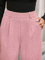 Close-up of pink pants with a blurred background
