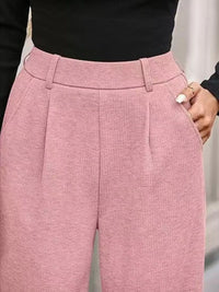 Close-up of pink pants with a blurred background