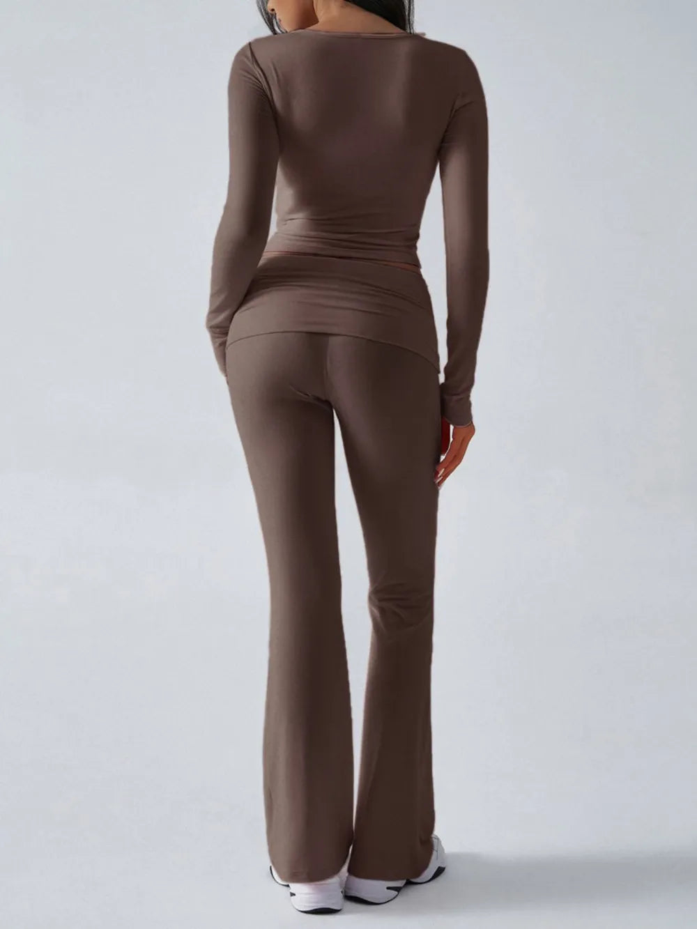 Brown long-sleeve top and pants set on a white background