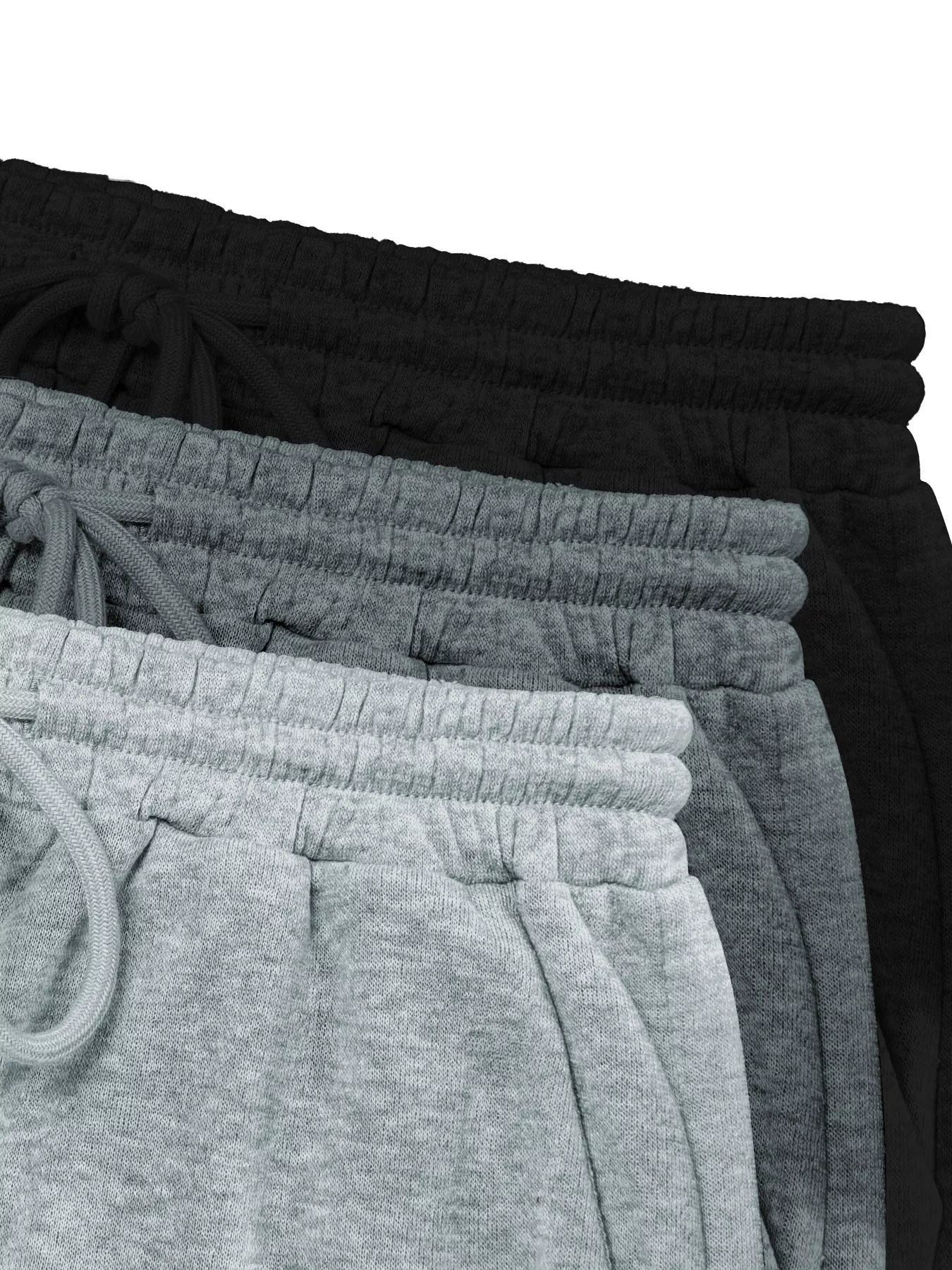 Stack of black and gray sweatpants on a white background