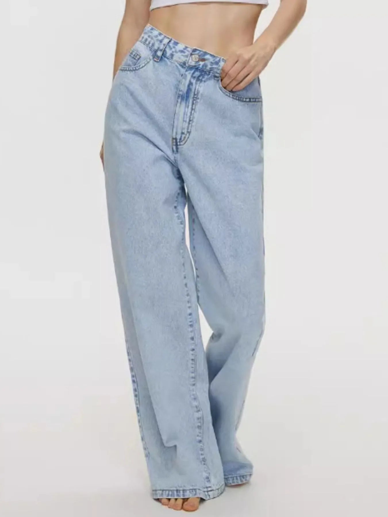 Light blue jeans worn by a person on a white background