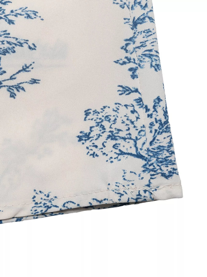 White fabric with blue floral pattern on a white background