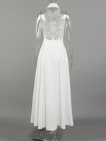 White dress with sheer sleeves on a gray background