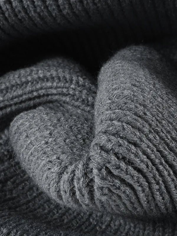 Close-up of gray knitted fabric with a textured pattern