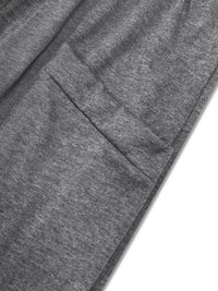 Close-up of gray fabric with a pocket detail on a white background