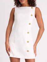 White dress with gold buttons on a white background