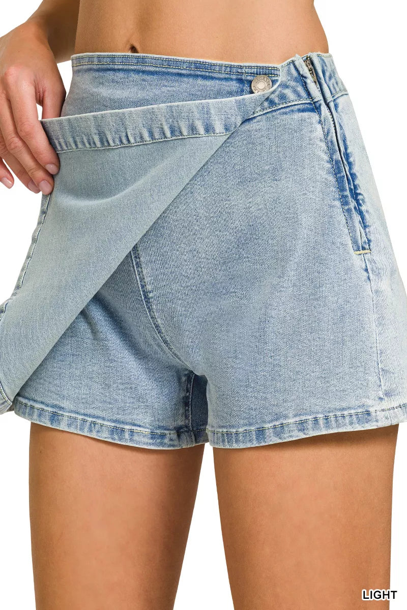 Light blue denim shorts being worn on a white background