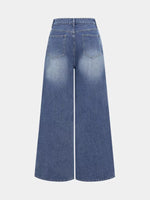 Blue wide-leg jeans on a light gray background