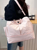Person holding a pink bag with a visible brand logo in an indoor setting