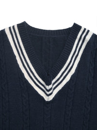 Navy sweater with a white V-neckline on a white background