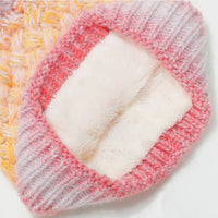 Multicolored knitted headband with a textured pattern on a white background