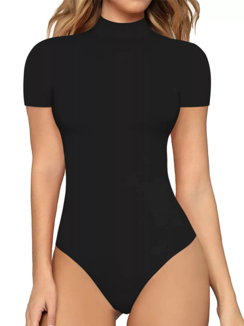 Black bodysuit worn by a model on a white background
