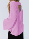 Pink sweater with a cut-out design on a white background