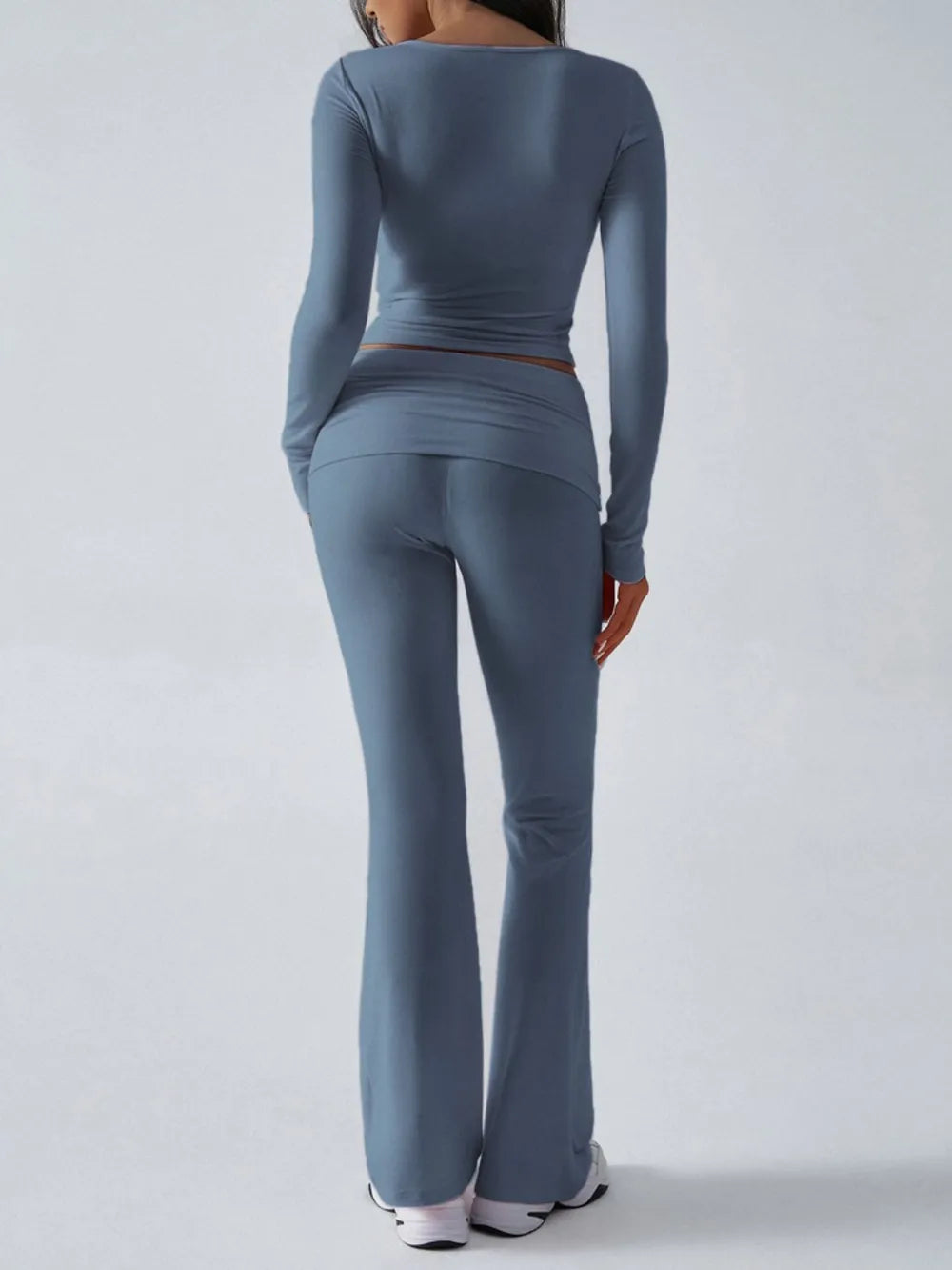 Person wearing a blue athletic outfit on a white background
