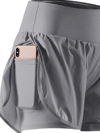 Gray athletic skirt with a pocket holding a phone on a white background